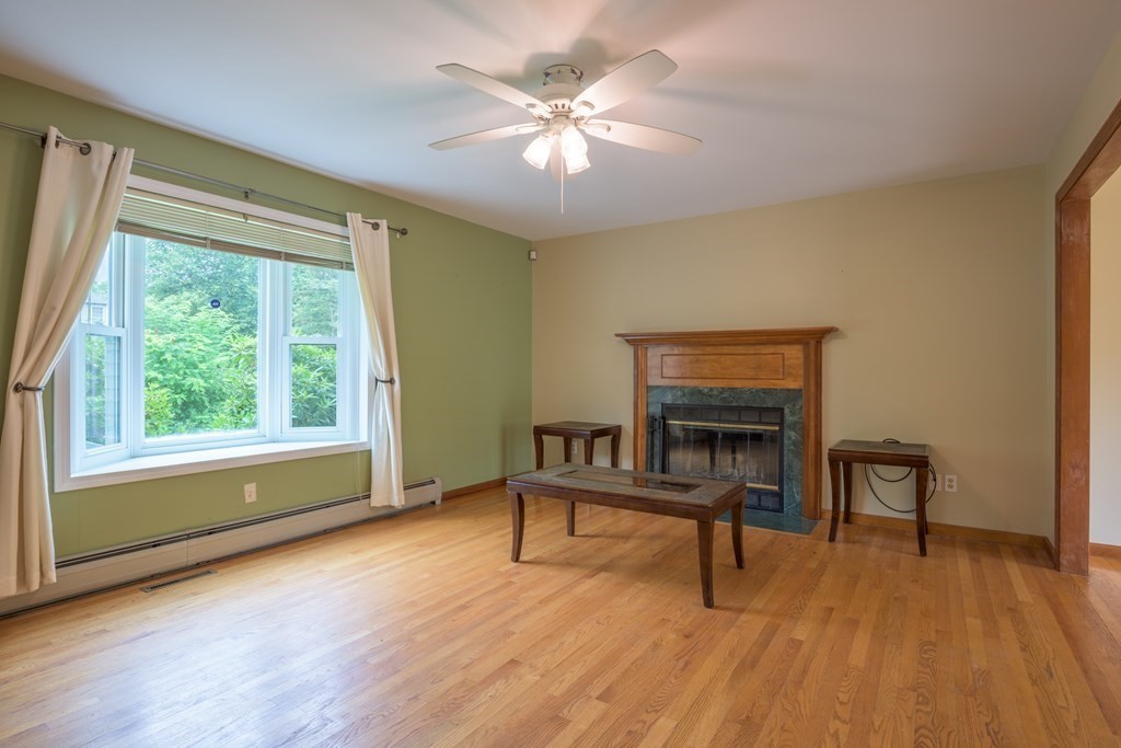 2 Wintergreen Circle Amherst, MA 01002 - Photo 9 of 37 a living room with furniture and a fireplace