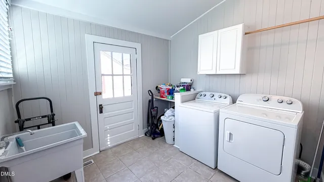 a view of a workspace with wooden floor and a window