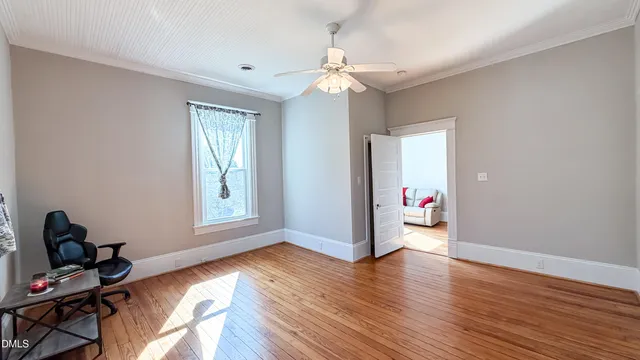 a view of a livingroom with furniture and a window