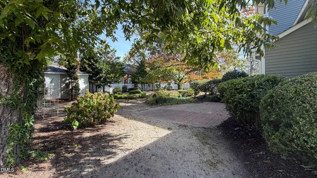 a view of a house with a yard and plants
