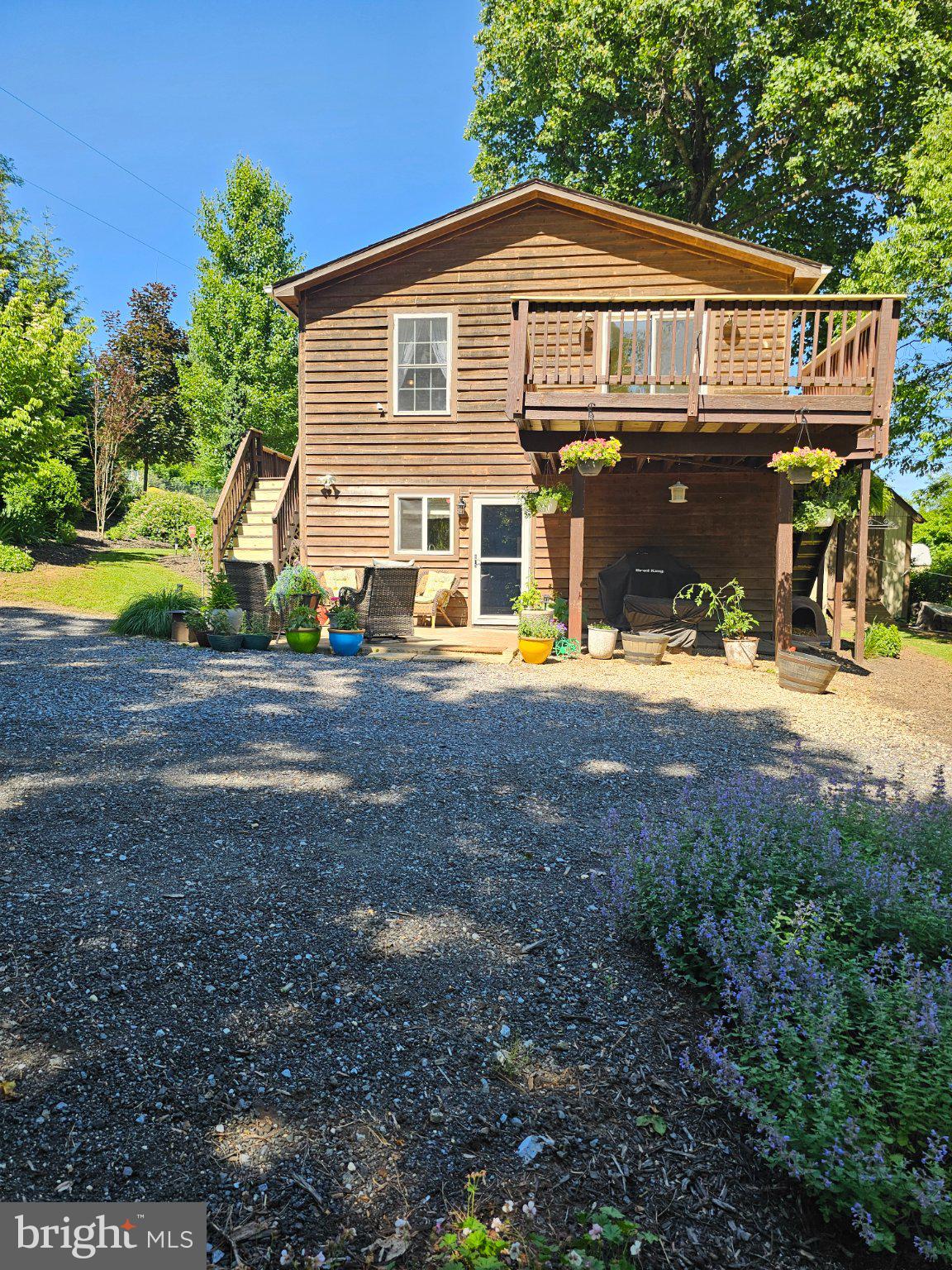 32 Parnassus Road Linden, VA 22642 - Photo 6 of 50 Charming wooden retreat with lush greenery.