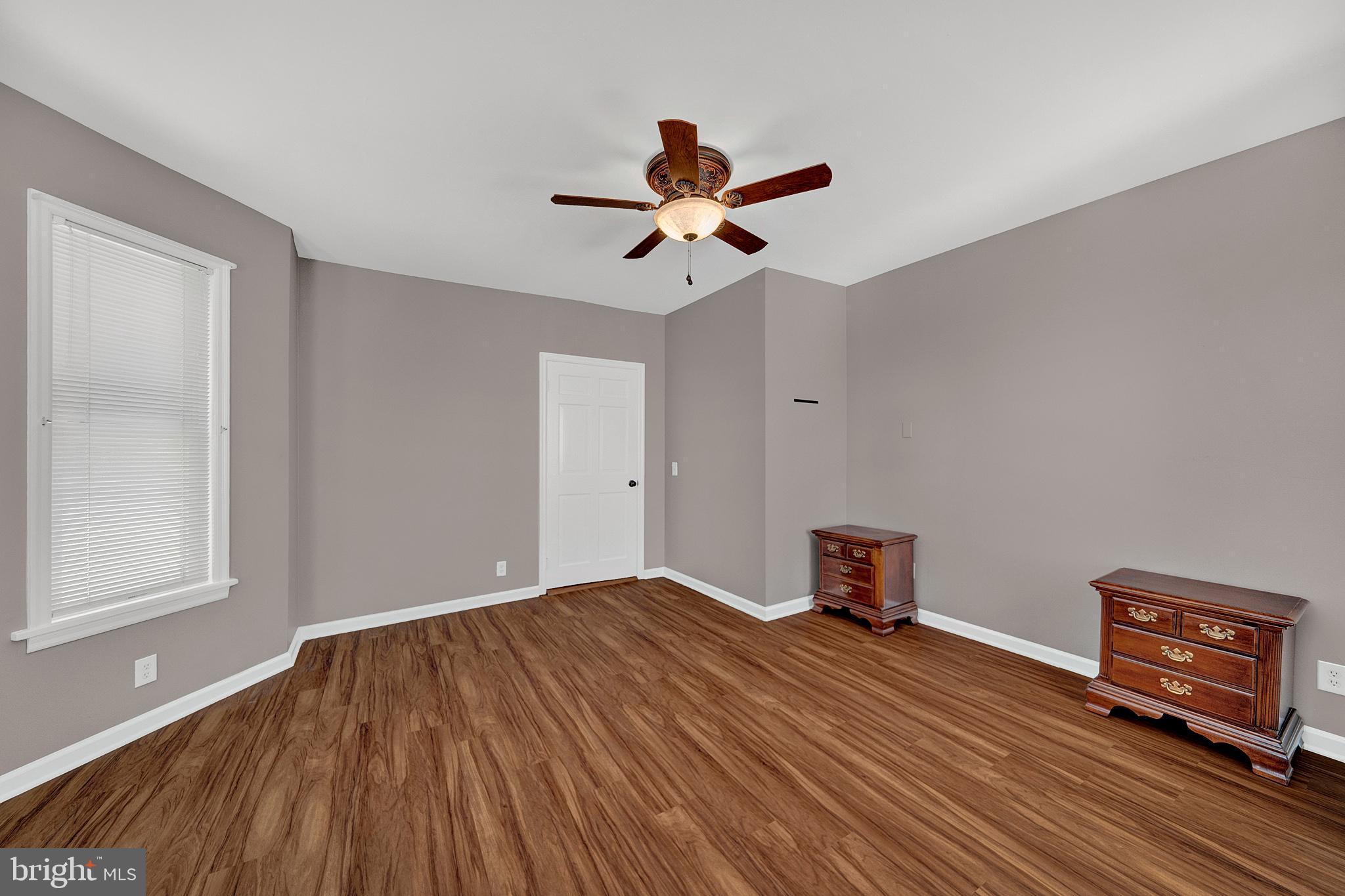 145 Hopewell - Wertsville Road Hopewell, NJ 08525 - Photo 15 of 39 a bedroom with a bed and a chandelier