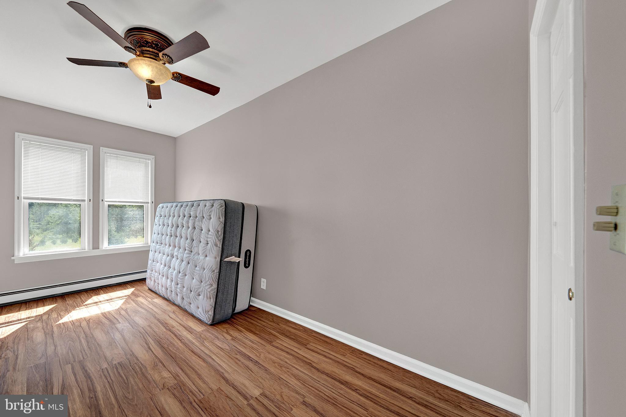 145 Hopewell - Wertsville Road Hopewell, NJ 08525 - Photo 19 of 39 wooden floor in an empty room with a window