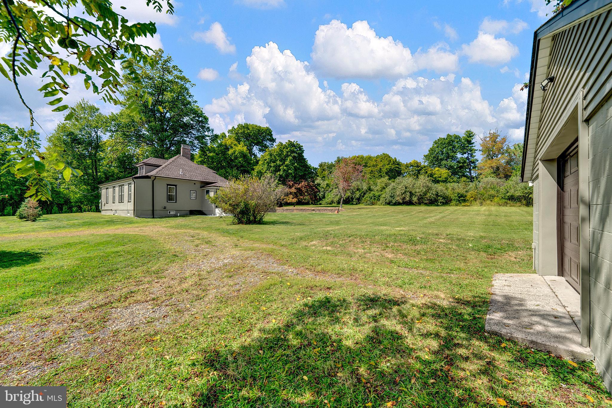 145 Hopewell - Wertsville Road Hopewell, NJ 08525 - Photo 29 of 39 a house view with swimming pool and garden space