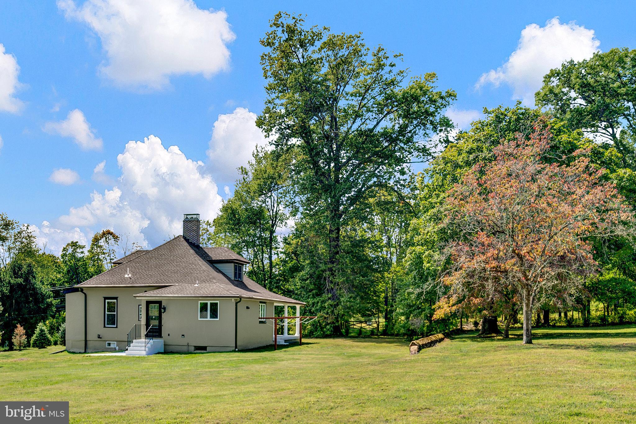 145 Hopewell - Wertsville Road Hopewell, NJ 08525 - Photo 31 of 39 a front view of house with yard and trees in the background
