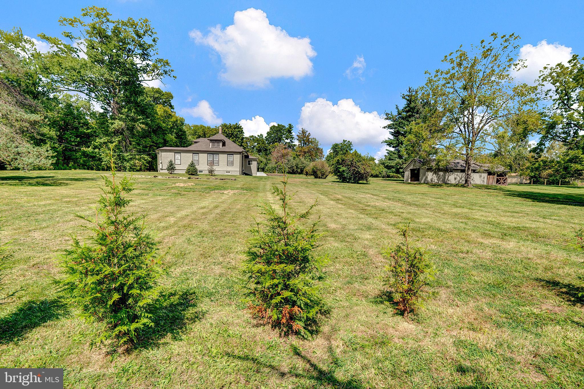 145 Hopewell - Wertsville Road Hopewell, NJ 08525 - Photo 32 of 39 a view of a big yard with swimming pool and large trees