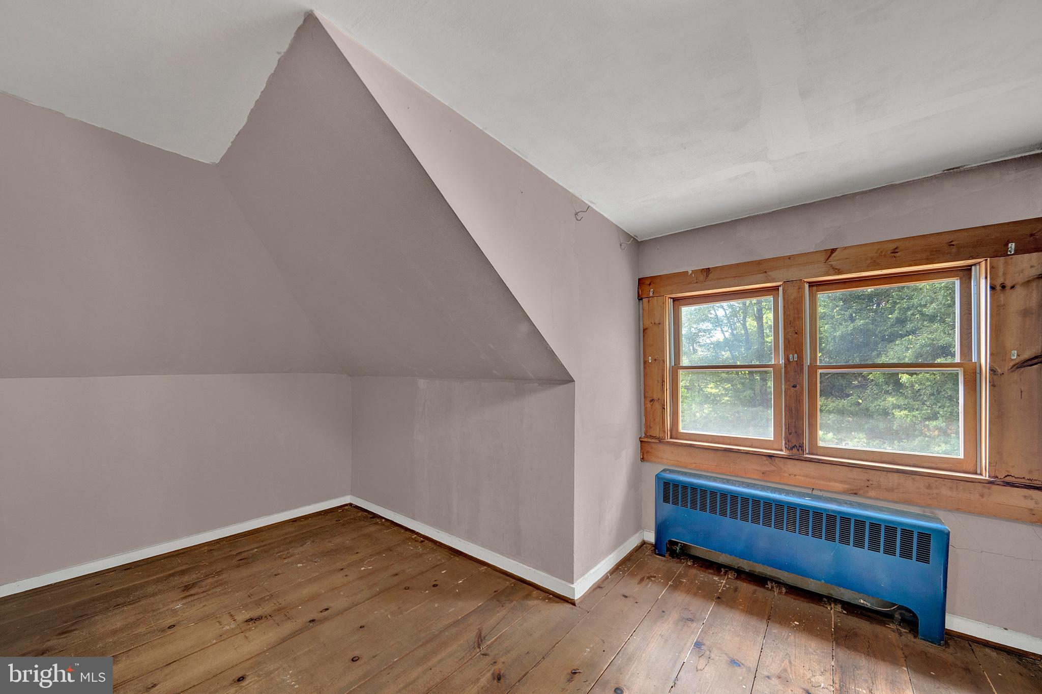 145 Hopewell - Wertsville Road Hopewell, NJ 08525 - Photo 35 of 39 a view of an empty room with wooden floor and a window