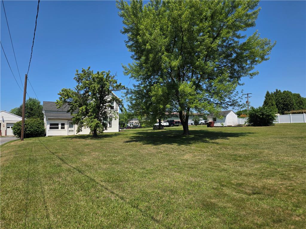 5166 Springmill Road Whitehall, PA 18052 - Photo 5 of 29 Generous green lawn with established shade trees, offering ample outdoor space.