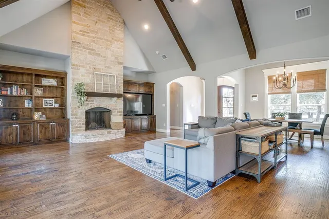 a living room with fireplace furniture and a fireplace