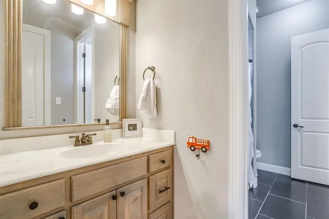 a bathroom with a sink double vanity and a mirror