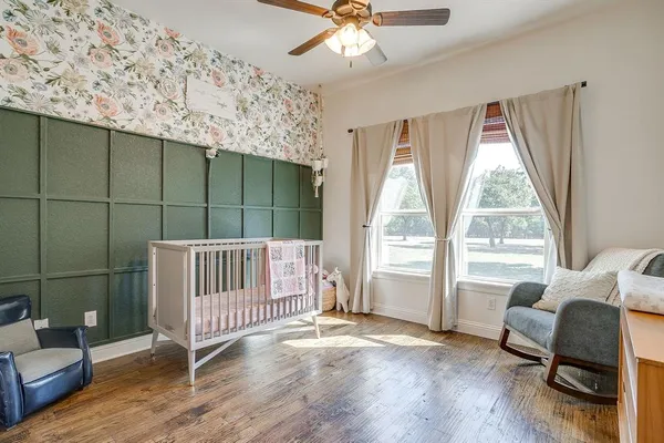 a view of a livingroom with furniture and a floor to ceiling window