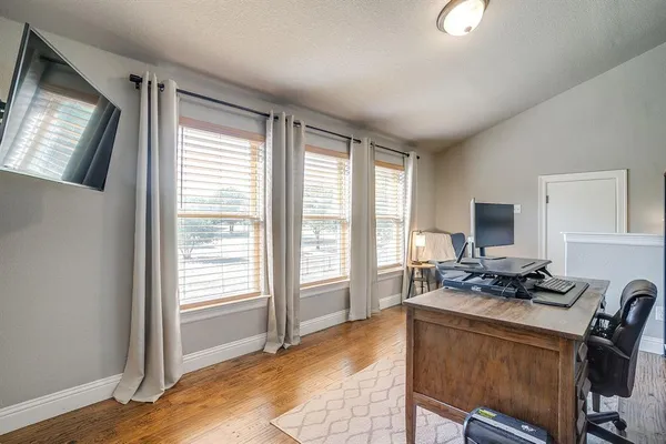 a bedroom with furniture and a window
