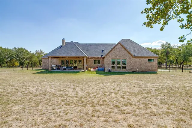 a house with trees in the background