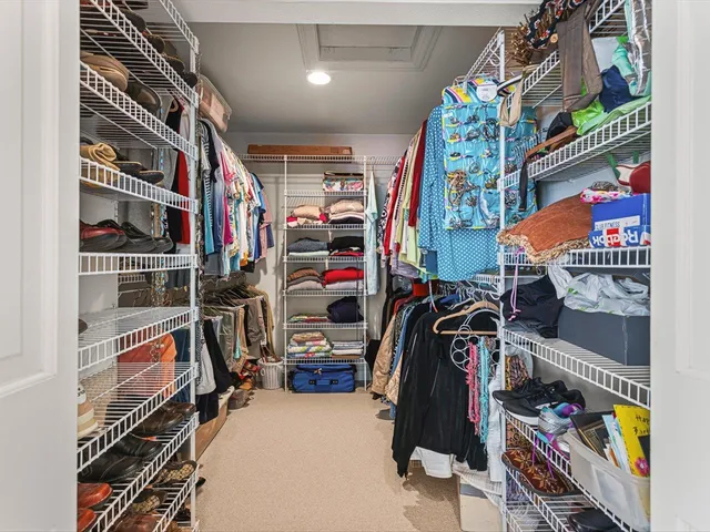 a living room with furniture wooden floor and a table