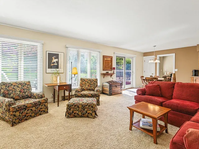 a kitchen with stainless steel appliances sink cabinets and window