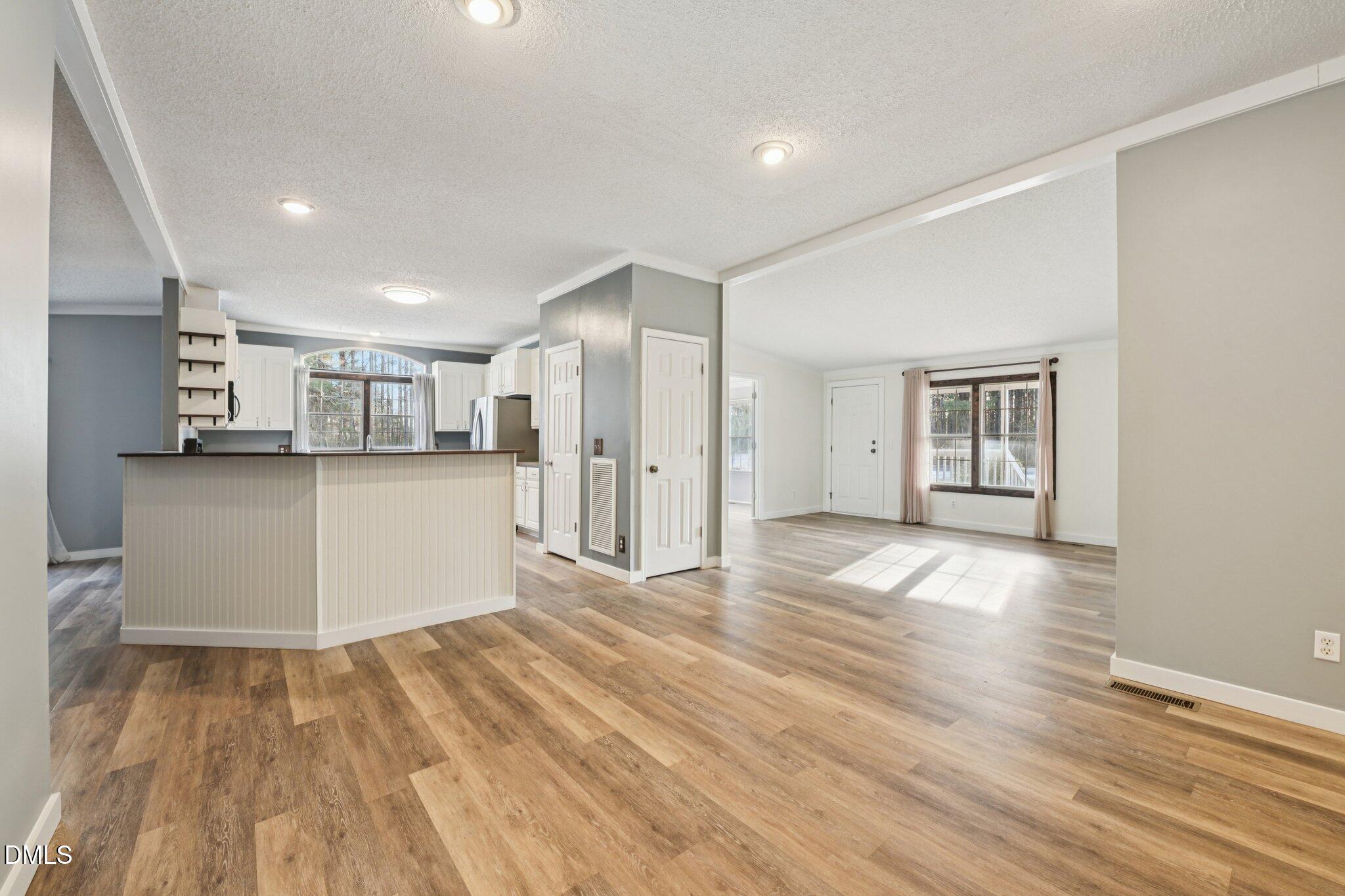 5393 Frazier Road Spring Hope, NC 27882 - Photo 3 of 23 a view of a kitchen with wooden floor and a kitchen