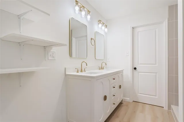 a bathroom with a sink and a mirror