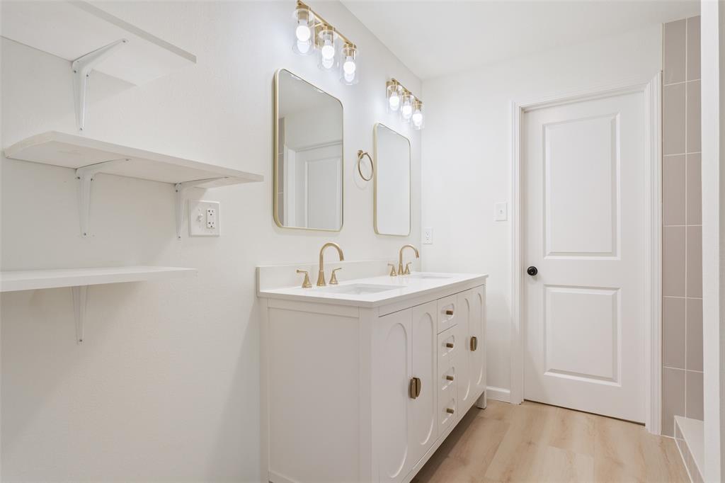 1029 North 45th Street Waco, TX 76710 - Photo 20 of 35 a bathroom with a sink and a mirror