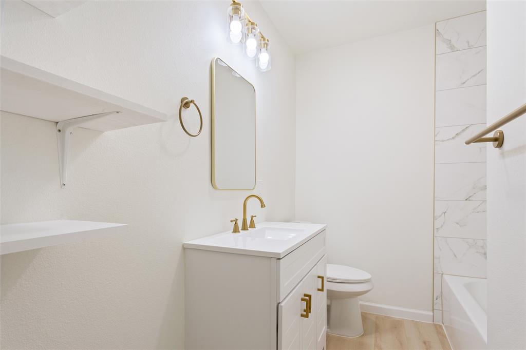 1029 North 45th Street Waco, TX 76710 - Photo 22 of 35 a bathroom with a sink a toilet and shower