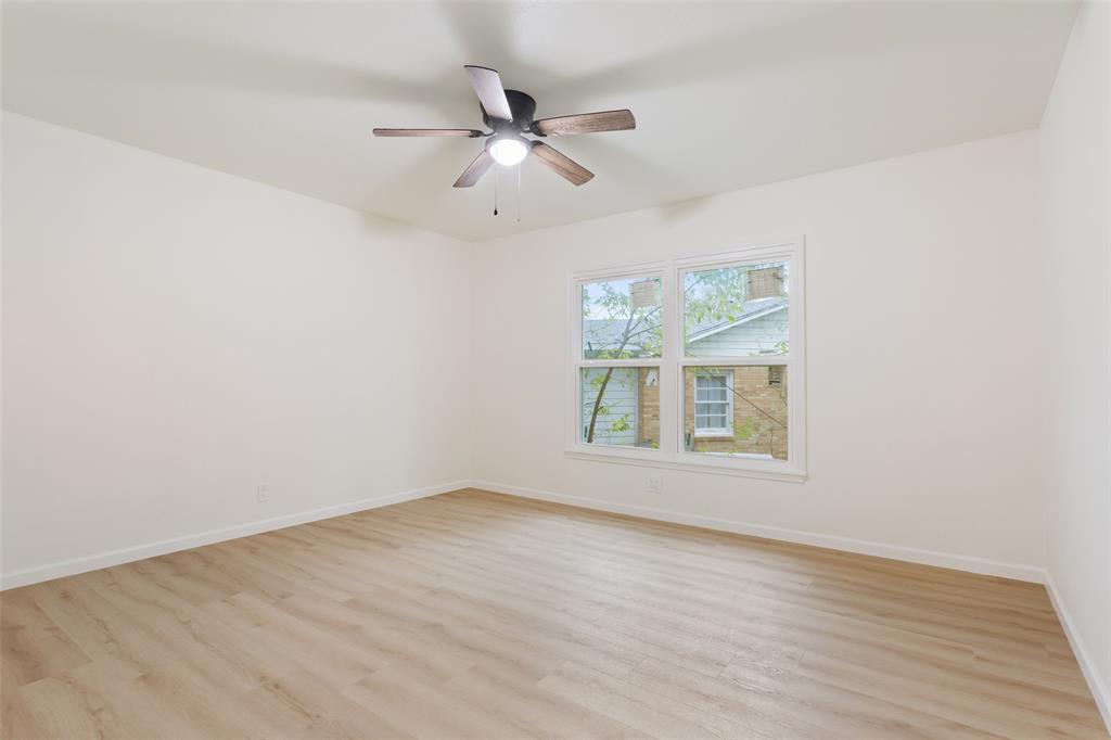 1029 North 45th Street Waco, TX 76710 - Photo 27 of 35 an empty room with wooden floor fan and windows