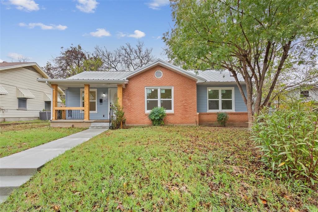 1029 North 45th Street Waco, TX 76710 - Photo 3 of 35 a view of a yard in front of a house with large trees