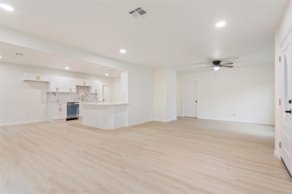 1029 North 45th Street Waco, TX 76710 - Photo 9 of 35 a view of a kitchen with kitchen island and stainless steel appliances