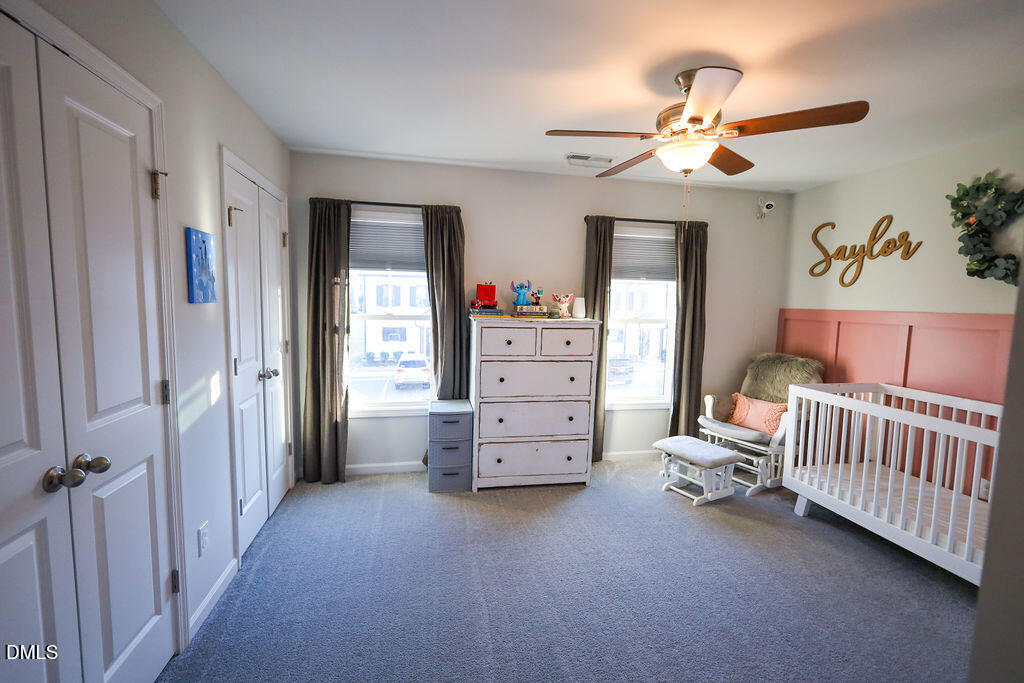 230 South Raleigh Street Angier, NC 27501 - Photo 31 of 38 a view of a bedroom with furniture and windows