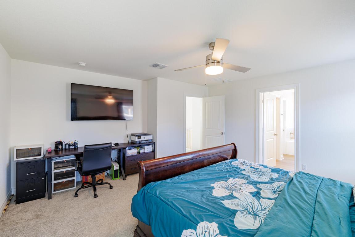 4641 Alfano Loop Round Rock, TX 78665 - Photo 22 of 32 a living room with furniture and a flat screen tv
