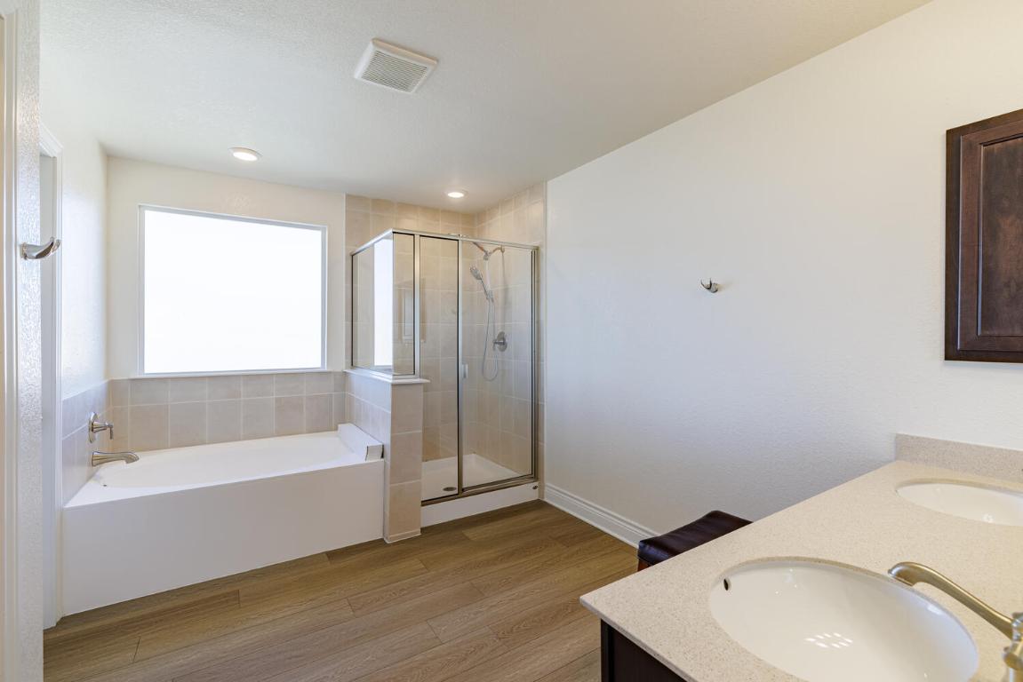 4641 Alfano Loop Round Rock, TX 78665 - Photo 24 of 32 a bathroom with a bathtub and a sink