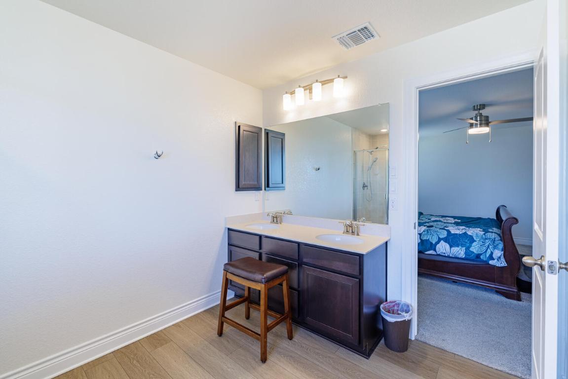 4641 Alfano Loop Round Rock, TX 78665 - Photo 25 of 32 a view of a room that has a table and chairs in it