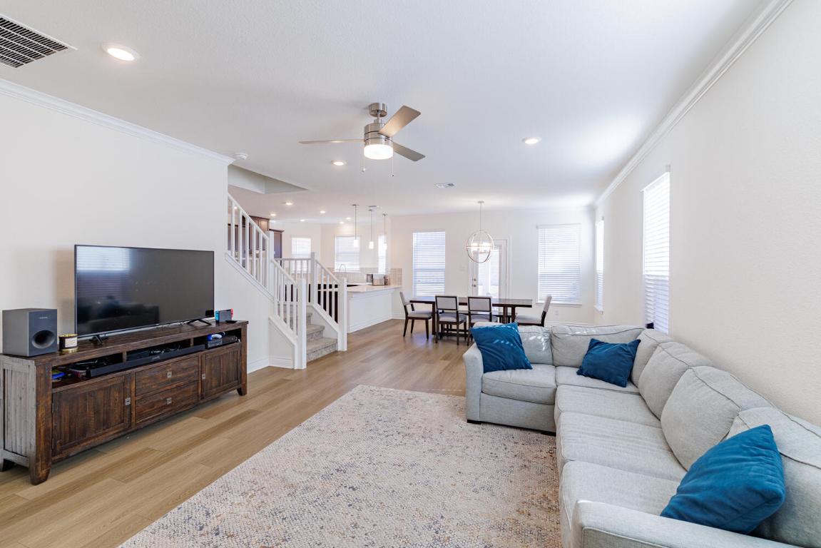 4641 Alfano Loop Round Rock, TX 78665 - Photo 4 of 32 a living room with furniture and a flat screen tv