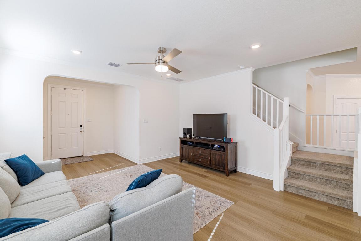 4641 Alfano Loop Round Rock, TX 78665 - Photo 7 of 32 a living room with furniture and a flat screen tv
