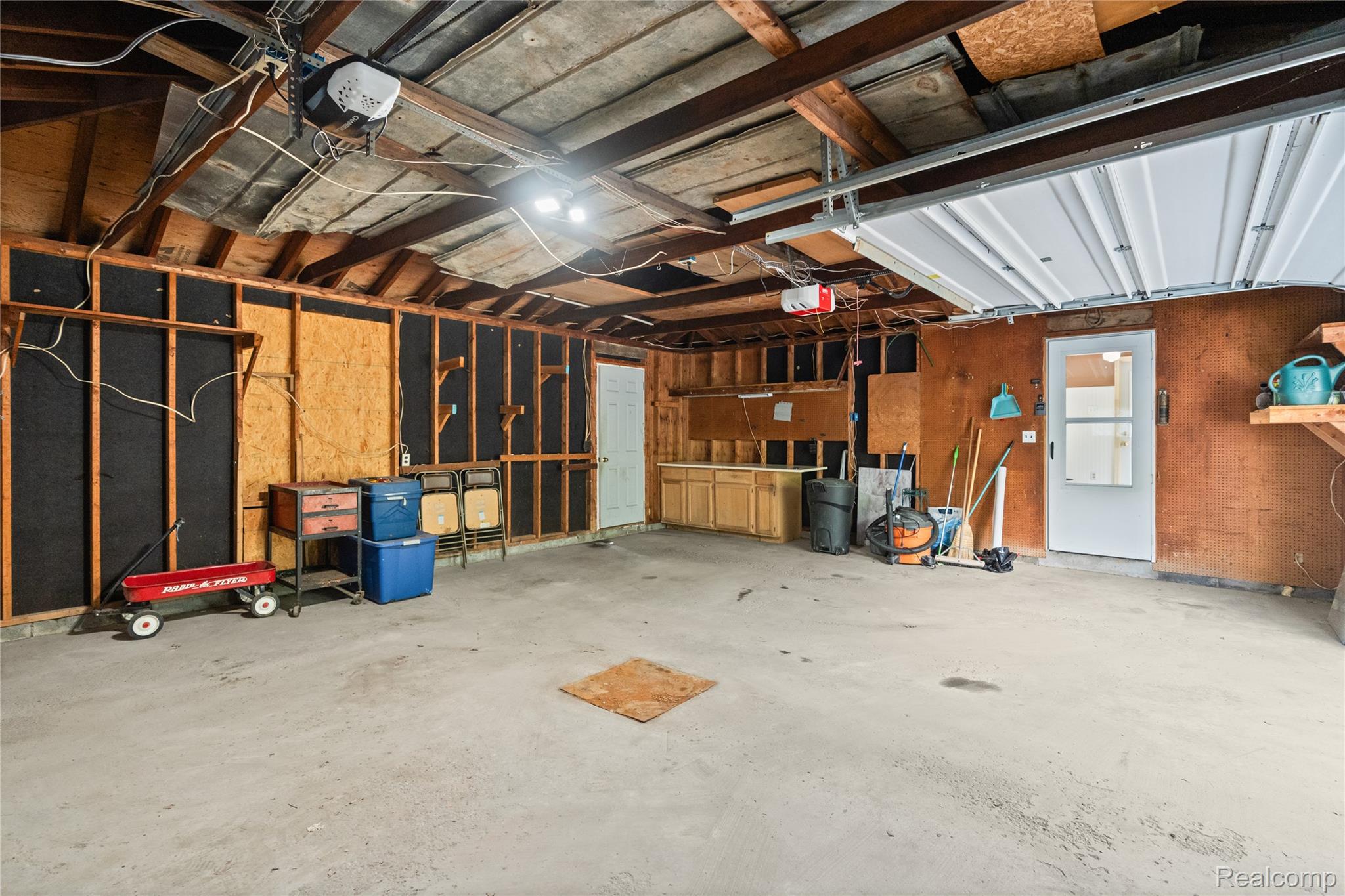 1715 North Oxford Road Oxford, MI 48371 - Photo 24 of 29 220V, concrete flooring, and built-in cabinetry
