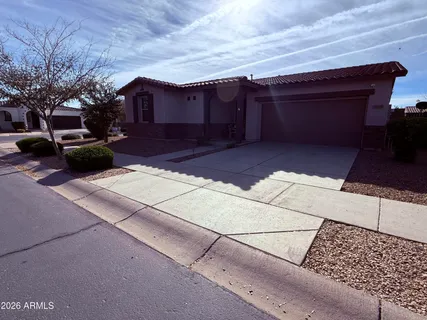 a view of a patio with table and chairs with wooden fence and plants