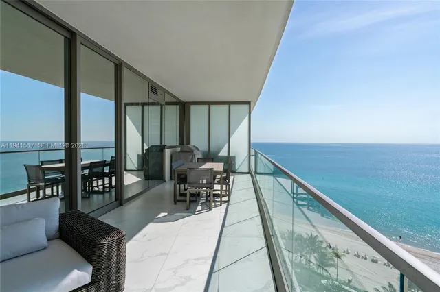 a terrace with a table and chairs