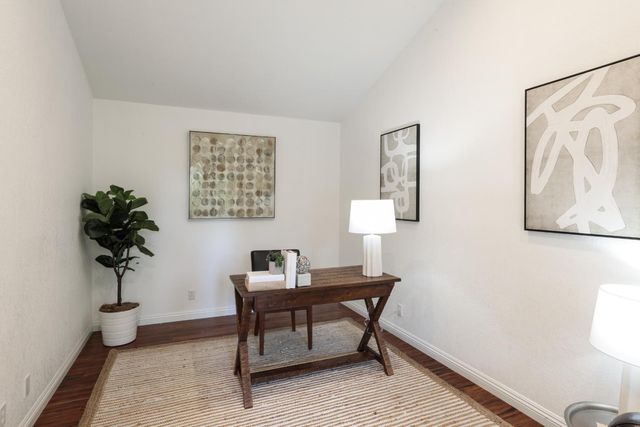 a workspace with furniture and window