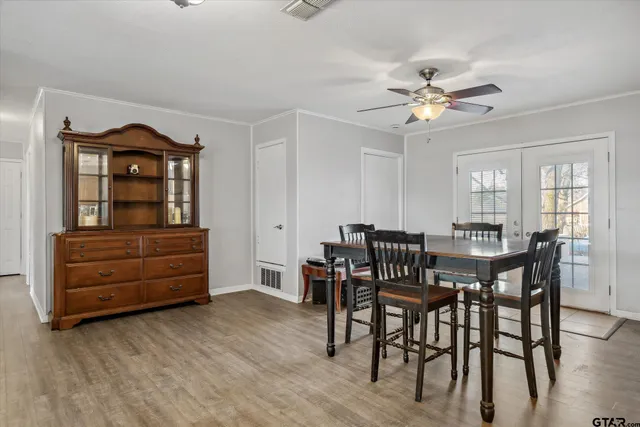 a view of a dining room with furniture and window
