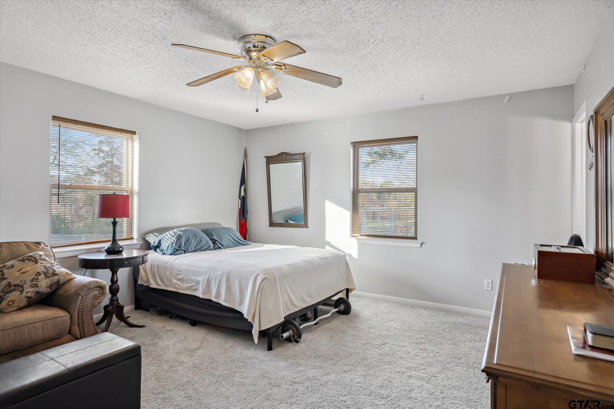 542 South Houston Street Edgewood, TX 75117 - Photo 20 of 37 a bedroom with a bed window and a bed