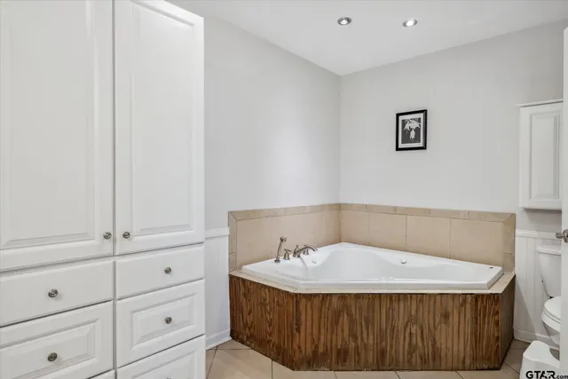 a bathroom with a sink and vanity