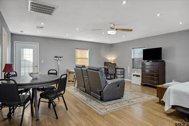 a view of a livingroom with furniture window and wooden floor