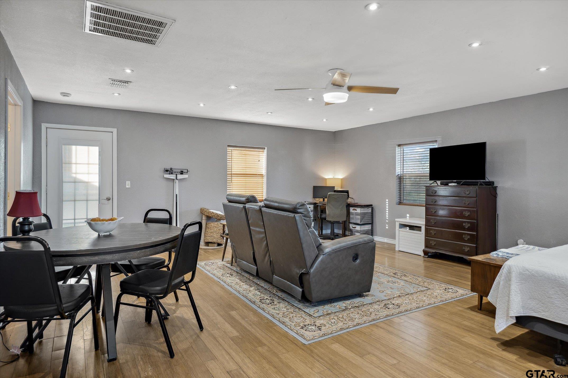 542 South Houston Street Edgewood, TX 75117 - Photo 34 of 37 a view of a livingroom with furniture window and wooden floor