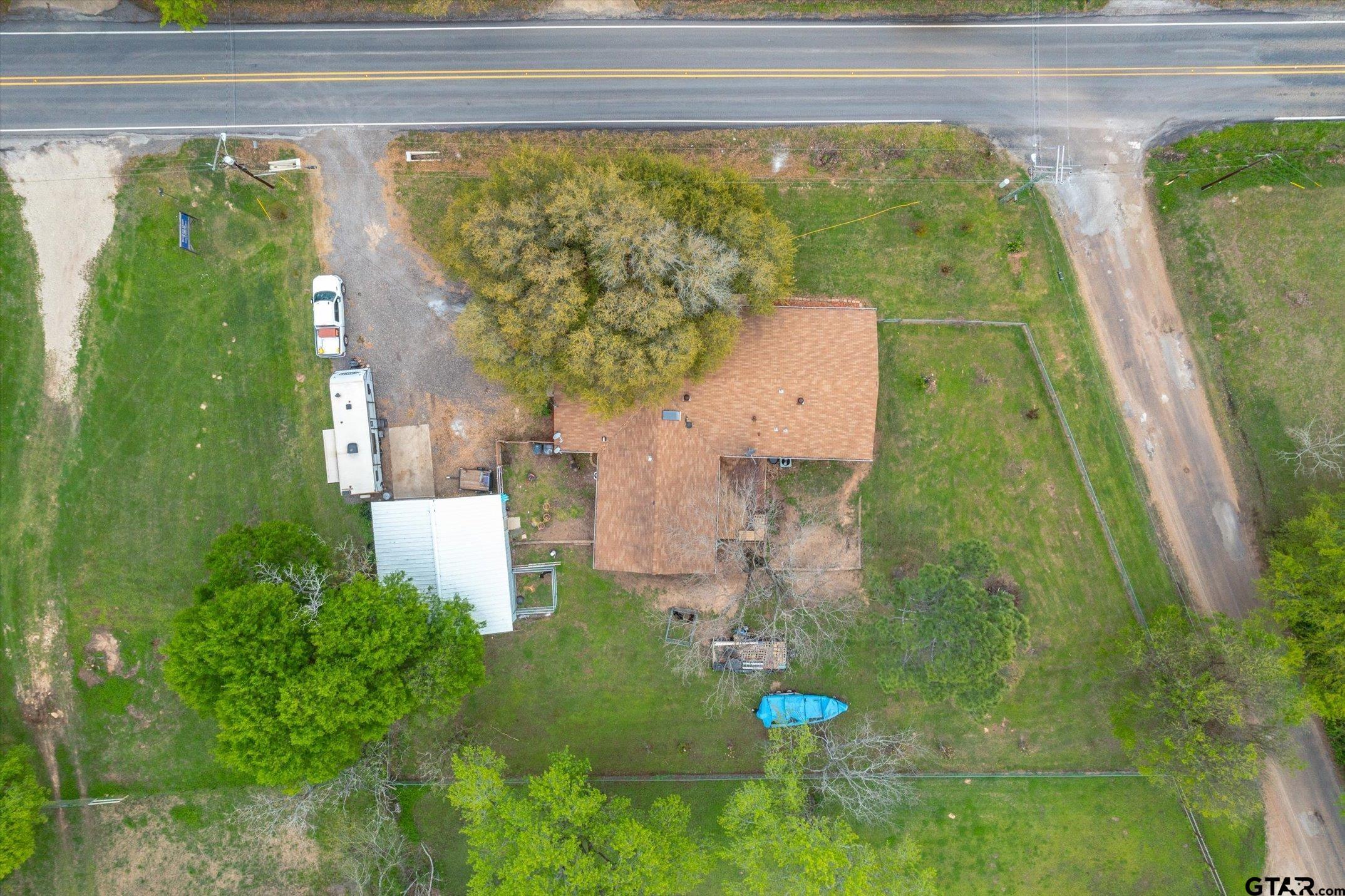 542 South Houston Street Edgewood, TX 75117 - Photo 5 of 37 a bathroom with a sink and mirror