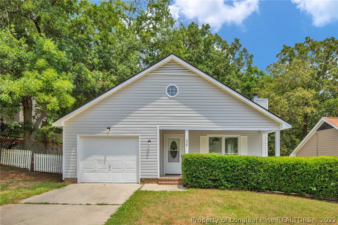 512 Andover Road Fayetteville, NC 28311 - Photo 1 of 18 a front view of a house with a garden and plants