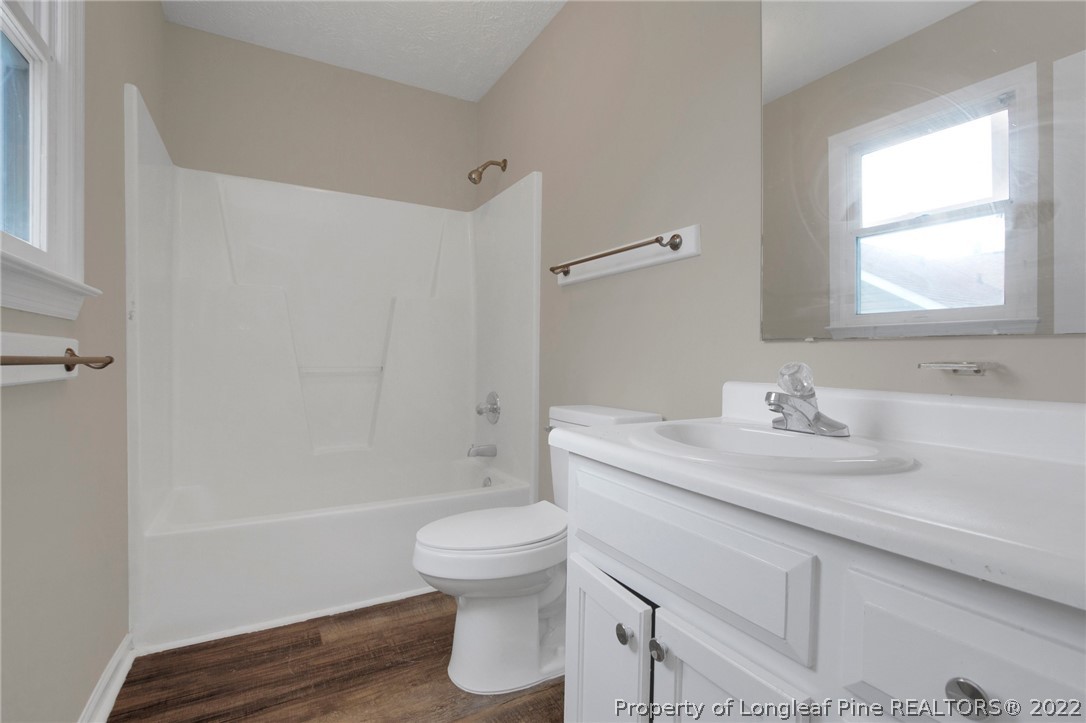 512 Andover Road Fayetteville, NC 28311 - Photo 12 of 18 a bathroom with a sink toilet and shower