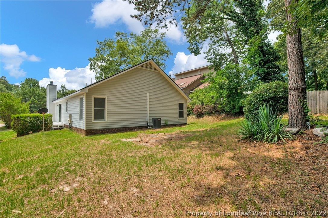 512 Andover Road Fayetteville, NC 28311 - Photo 17 of 18 a view of a house with backyard and garden