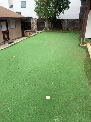 a view of a backyard with a small cabin