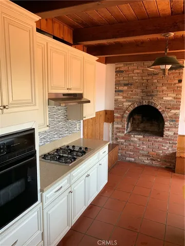 a kitchen with stainless steel appliances a stove and a refrigerator