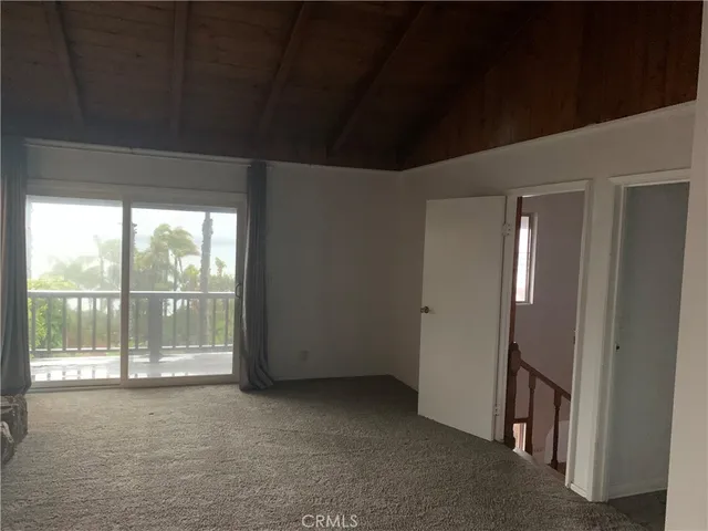 a view of a room with large windows