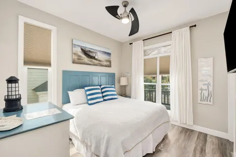 a bedroom with a large bed and a window