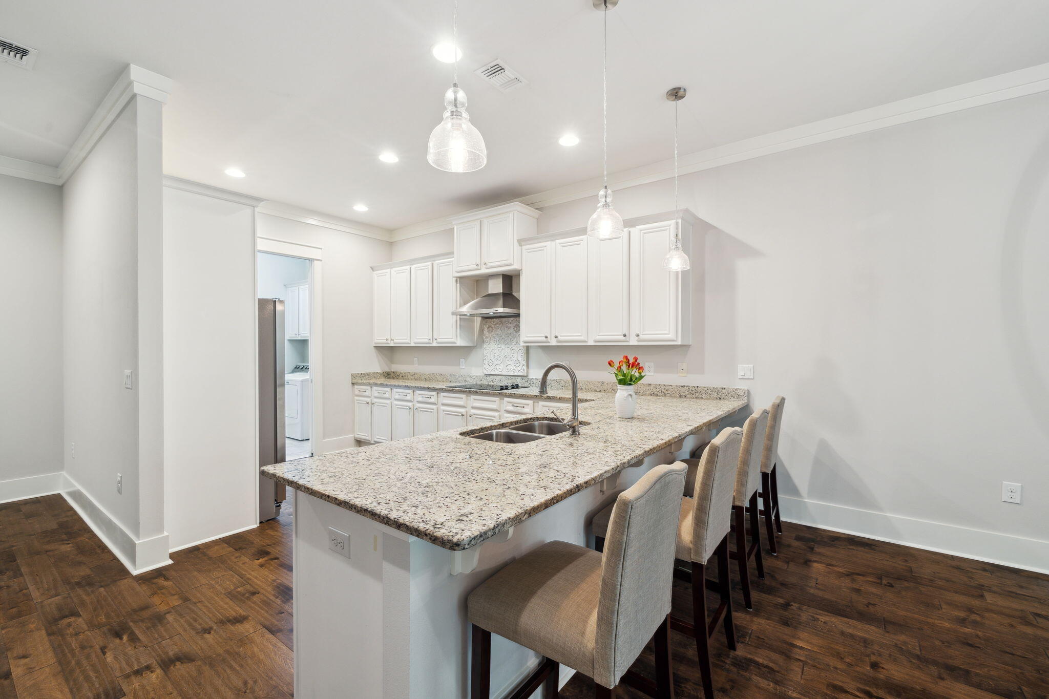 180 Blakely Drew Boulevard Santa Rosa Beach, FL 32459 - Photo 15 of 40 a kitchen with a table and chairs in it